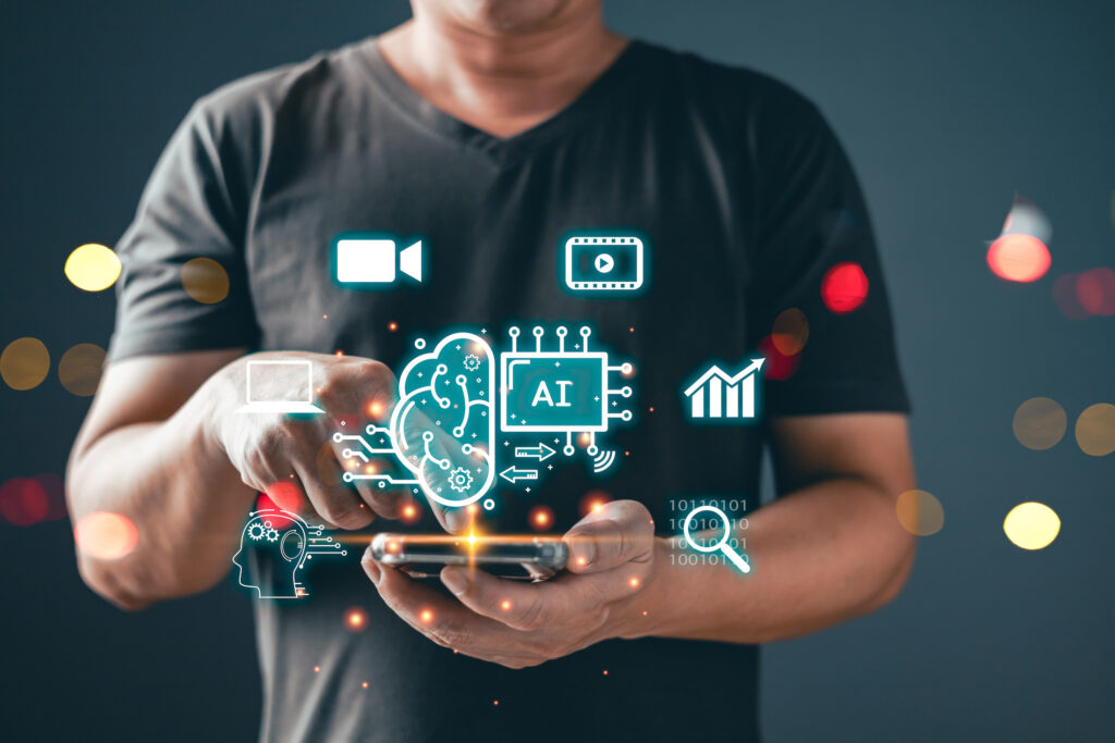 Man's hands holding a phone with AI, video, and analytics graphics superimposed.